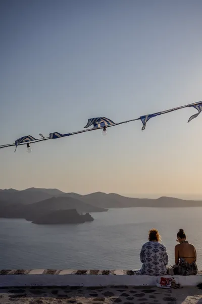 People enjoying sunset in Milos, Greece