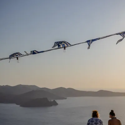 People enjoying sunset in Milos, Greece